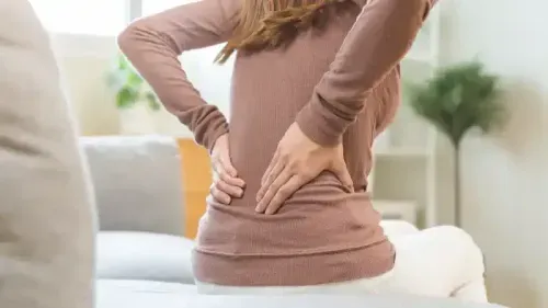 Lower Back Pain Causes in Women: Symptoms, Treatments and More